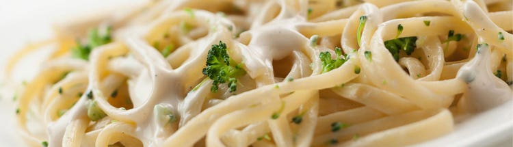 Creamy pasta with sauce, representing savory product ingredient solutions