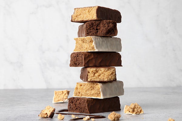 Stack of protein bars in different flavors, showcasing plant protein snack solutions