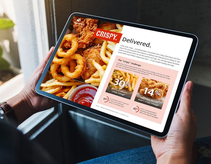 Tablet showing onion rings and crispy foods, emphasizing delivery-ready coatings.
